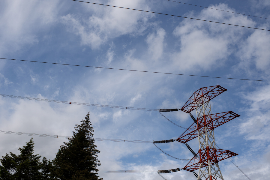 Powerlines are seen near the Bonneville Lock and Dam from the Washington side of the Columbia River. The challenges connecting a new energy-intensive business development to the region&rsquo;s power grid can be costly and time consuming, perhaps making the county less attractive for these endeavors.