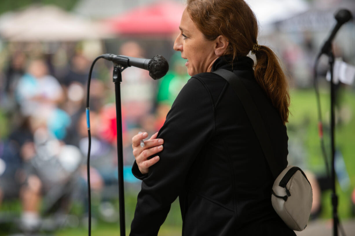 Nicole Hamberger, community engagement specialist for Southwest Washington Accountable Community of Health, demonstrates how to inject naloxone at the Sept. 2 Hands Across the Bridge event in downtown Vancouver.