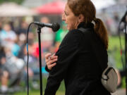 Nicole Hamberger, community engagement specialist for Southwest Washington Accountable Community of Health, demonstrates how to inject naloxone at the Sept. 2 Hands Across the Bridge event in downtown Vancouver.