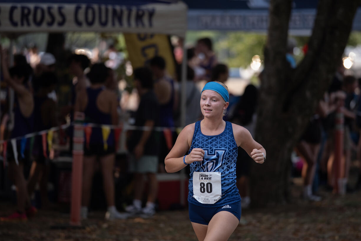 Hockinson's Lyla Taylor keeps the pace while on her way to taking first place in the girls varsity race during the 63rd annual Steve Maas Run-a-Ree cross country race at Hudsons Bay High School on Friday evening, Sept. 6, 2024.