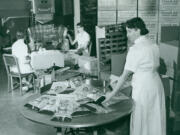 Workers prepare bags of chips in 1958 at the Good-ee Potato Chip Co. of downtown Vancouver.