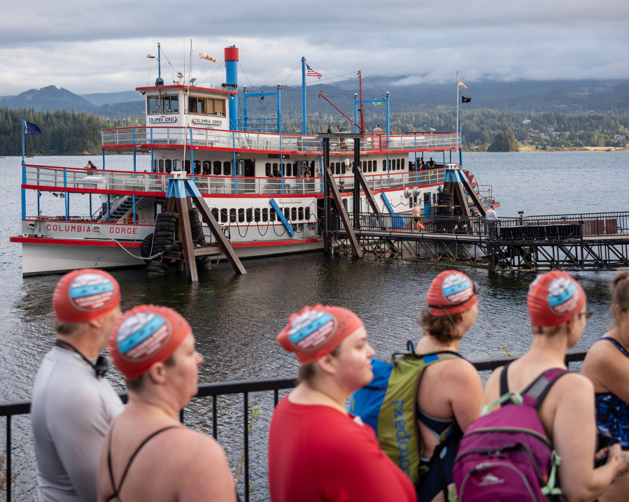 Swimmers wait in line to board the sternwheeler Columbia Gorge on Monday before the 80th Columbia River Cross Channel Swim.