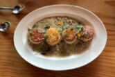 Seared scallops with wild mushroom truffle sauce.