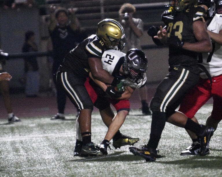 Hunter Gibson-Kubala (24) of Union is tackles by Mark Williams Jr. (10) of Evergreen during a non-league football game at McKenzie Stadium on Friday, Sept. 6, 2024.