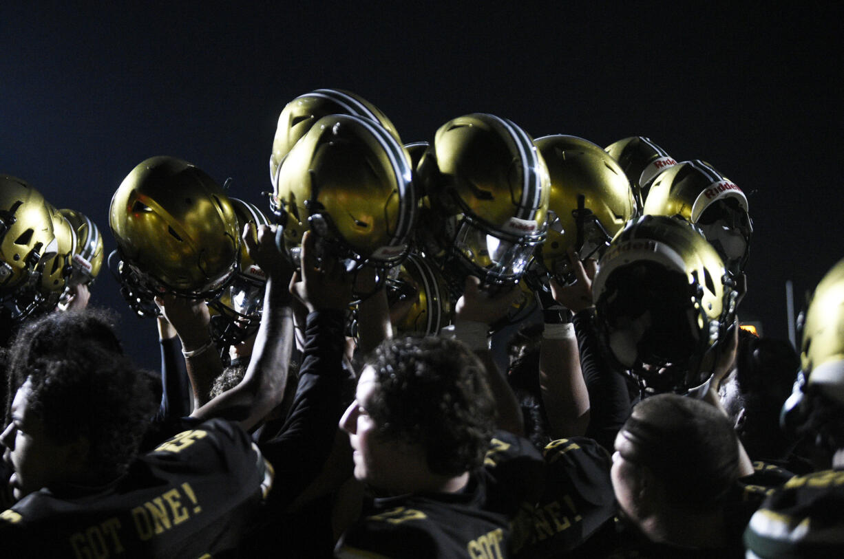 Evergreen players celebrate their 18-0 win over Union in a non-league football game at McKenzie Stadium on Friday, Sept. 6, 2024.