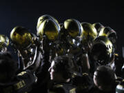 Evergreen players celebrate their 18-0 win over Union in a non-league football game at McKenzie Stadium on Friday, Sept. 6, 2024.