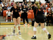 Battle Ground volleyball coach Dana Snodgrass, center, cheers as players Savannah Snodgrass (10) and Lilly Sappington (6) celebrate a point during a season-opening match against Hudson&rsquo;s Bay on Wednesday, Sept. 4, 2024 at Battle Ground High School.