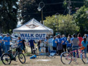 Union members and supporters gather for a barbecue at Mill Plain Park during a walkout Tuesday afternoon. Clark College classified union members walked out to raise awareness of stalled bargaining with the state.