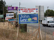 Political campaign signs are seen along state Highway 14 on Thursday morning. Legislative candidates in Clark County are reporting rampant vandalism and theft of campaign signs. &ldquo;This issue is much worse than what I experienced during my last campaign in 2022,&rdquo; said 17th Legislative District House Position 2 candidate Terri Niles, a Democrat.