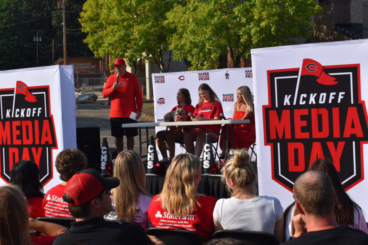 Camas activities coordinator Adam Mathieson, left, introduces members of the Camas volleyball team at Camas Media Days in downtown Camas on Sunday, Sept. 8, 2024.