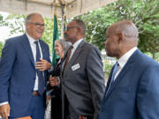 Gov. Jay Inslee, from left, talks with Smart Communities Awards recipients Cassi Marshall of the Port of Camas-Washougal, Franklin Johnson of the Commission on Aging and Oliver Orjiako of Clark County Community Planning outside the Clark County Public Service Center on Thursday afternoon.