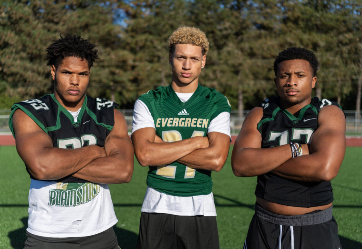 Evergreen seniors Makhi Miller, from left, Josiah Alanis and Mark Williams pose for a portrait Monday, Sept. 16, 2024, at Evergreen High School.