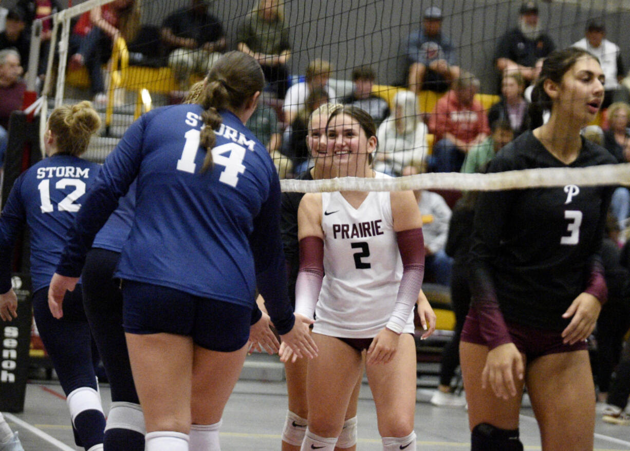 Prairie&#039;s Avery Etorno (2) greet&#039;s Skyview&#039;s Maddie Milhorn (14) before a volleyball match on Thursday, Sept. 12, 2024 at Prairie High School.