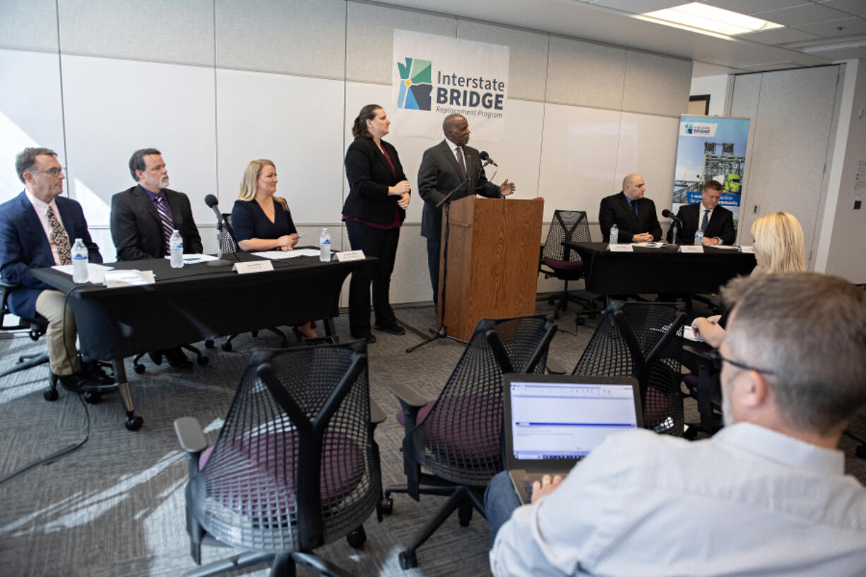 Interstate Bridge Replacement Program officials including administrator Greg Johnson, at podium, present an overview of the draft supplemental environmental impact statement during a press conference in downtown Vancouver on Friday morning.