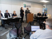 Interstate Bridge Replacement Program officials including administrator Greg Johnson, at podium, present an overview of the draft supplemental environmental impact statement during a press conference in downtown Vancouver on Friday morning.