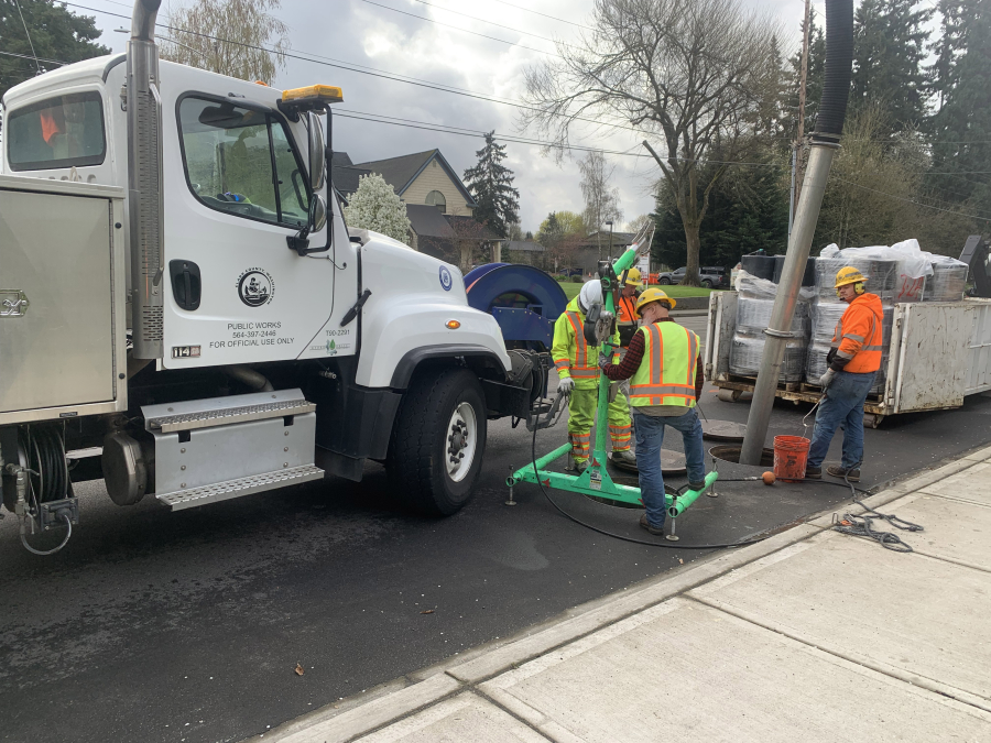 A Clark County Public Works crew replaces filter cartridges in an underground vault on Hazel Dell Avenue. Public Works&rsquo; clean water division is proposing new stormwater rates to keep pace with required services.