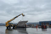 Crews work to build a wood pellet production facility in February at the Port of Longview. The goal of the UK-based company is to ship pellets to Asia, where they would be burned for energy.