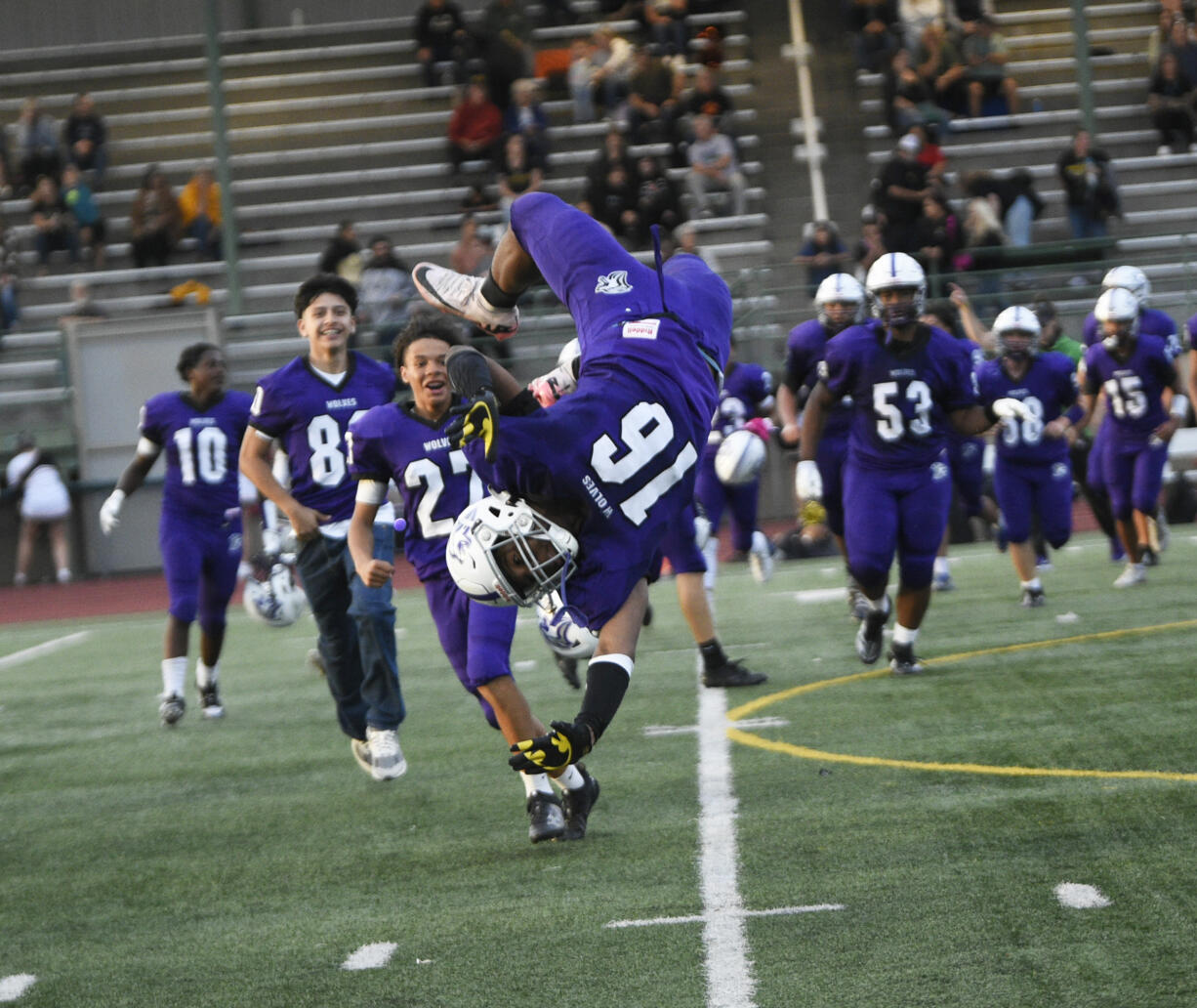 Isaiah James (16) of Heritage performs a somersault after the Timberwolves' 31-10 win over Hudson's Bay in a non-league football at McKenzie Stadium on Friday, Sept. 13, 2024.