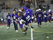 Isaiah James (16) of Heritage performs a somersault after the Timberwolves' 31-10 win over Hudson's Bay in a non-league football at McKenzie Stadium on Friday, Sept. 13, 2024.