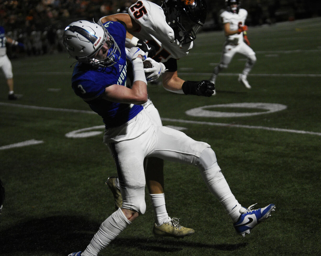 Dylan Huber (3) of Mountain View collides with Thomas Avery (25) of Battle Ground during a non-league football at McKenzie Stadium on Friday, Sept. 13, 2024.