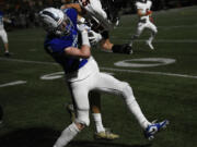 Dylan Huber (3) of Mountain View collides with Thomas Avery (25) of Battle Ground during a non-league football at McKenzie Stadium on Friday, Sept. 13, 2024.