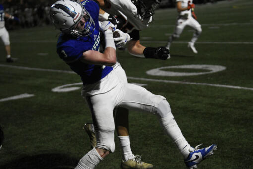 Dylan Huber (3) of Mountain View collides with Thomas Avery (25) of Battle Ground during a non-league football at McKenzie Stadium on Friday, Sept. 13, 2024.