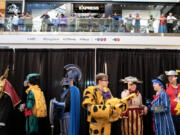 Participants in the Couve Con Chapter 3 cosplay competition wait behind the scenes to take center stage for judging at Vancouver Mall on Saturday afternoon. This was the third annual event hosted by the mall, which also featured vendors, a celebrity guest room, artists, panel sessions and a Wonka Factory room.