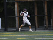 Derek White of Stevenson signals to his teammates after scoring his fourth touchdown against Fort Vancouver in a 1A Trico League football game at Kiggins Bowl on Friday, Sept. 20, 2024.