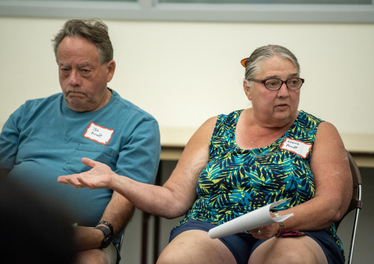 Laurie Arndt of Vancouver, right, talks to city councilors at Monday&rsquo;s community forum at the Educational Service District 112 building in Vancouver.