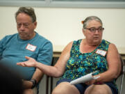 Laurie Arndt of Vancouver, right, talks to city councilors at Monday&rsquo;s community forum at the Educational Service District 112 building in Vancouver.