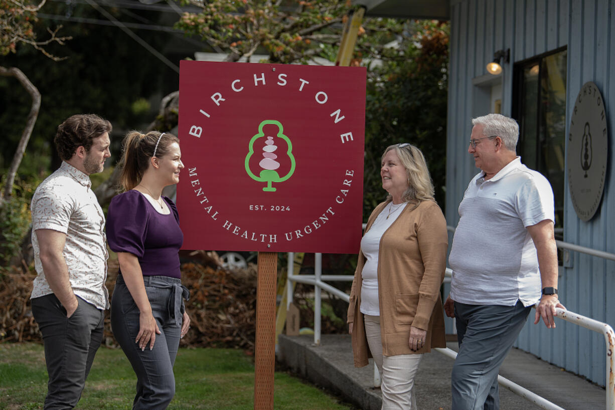 Therapists Brandon Fielding, from left, and his wife, Kelli Dougal, chat with fellow therapist Gayle Fielding and her husband, clinical psychologist Kelly Fielding, at Birchstone on Friday.