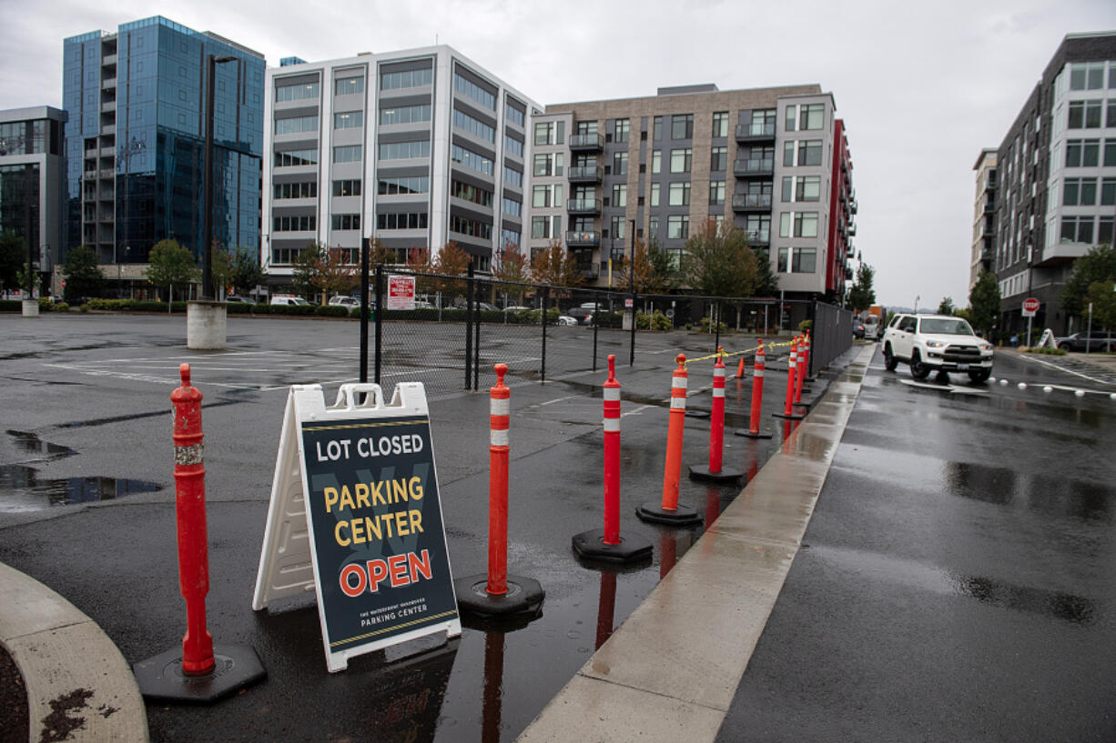 A sign notifies drivers that a surface parking lot near the new parking garage is closed at the Waterfront Vancouver. Some are having difficulty adjusting to the new parking garage and parking situation at the waterfront.