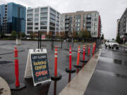 A sign notifies drivers that a surface parking lot near the new parking garage is closed at the Waterfront Vancouver. Some are having difficulty adjusting to the new parking garage and parking situation at the waterfront.