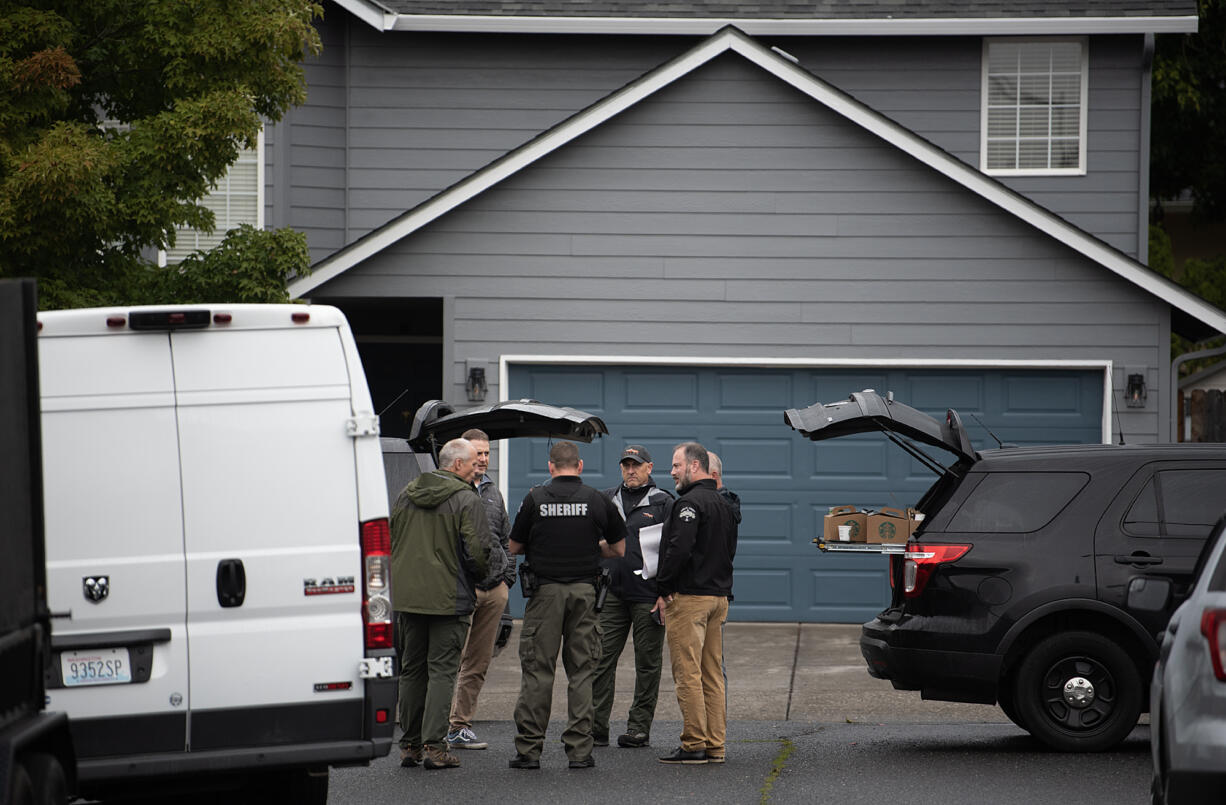 Law enforcement officials work in Walnut Grove after a Vancouver police officer who is a member of the SWAT team fatally shot a man after an hourslong standoff on Friday morning, Sept. 27, 2024.