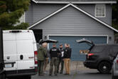 Law enforcement officials work in Walnut Grove after a Vancouver police officer who is a member of the SWAT team fatally shot a man after an hourslong standoff on Friday morning, Sept. 27, 2024.