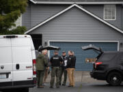 Law enforcement officials work in Walnut Grove after a Vancouver police officer who is a member of the SWAT team fatally shot a man after an hourslong standoff on Friday morning, Sept. 27, 2024.