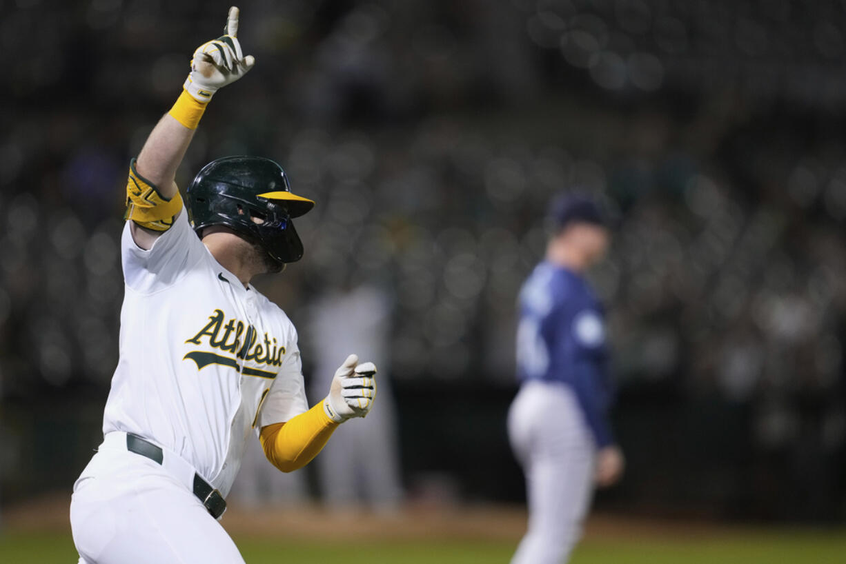 Oakland Athletics' Seth Brown celebrates after hitting a single to drive in the winning run in the ninth inning of a baseball game against the Seattle Mariners, Tuesday, Sept. 3, 2024, in Oakland, Calif. (AP Photo/Godofredo A.