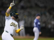 Oakland Athletics' Seth Brown celebrates after hitting a single to drive in the winning run in the ninth inning of a baseball game against the Seattle Mariners, Tuesday, Sept. 3, 2024, in Oakland, Calif. (AP Photo/Godofredo A.