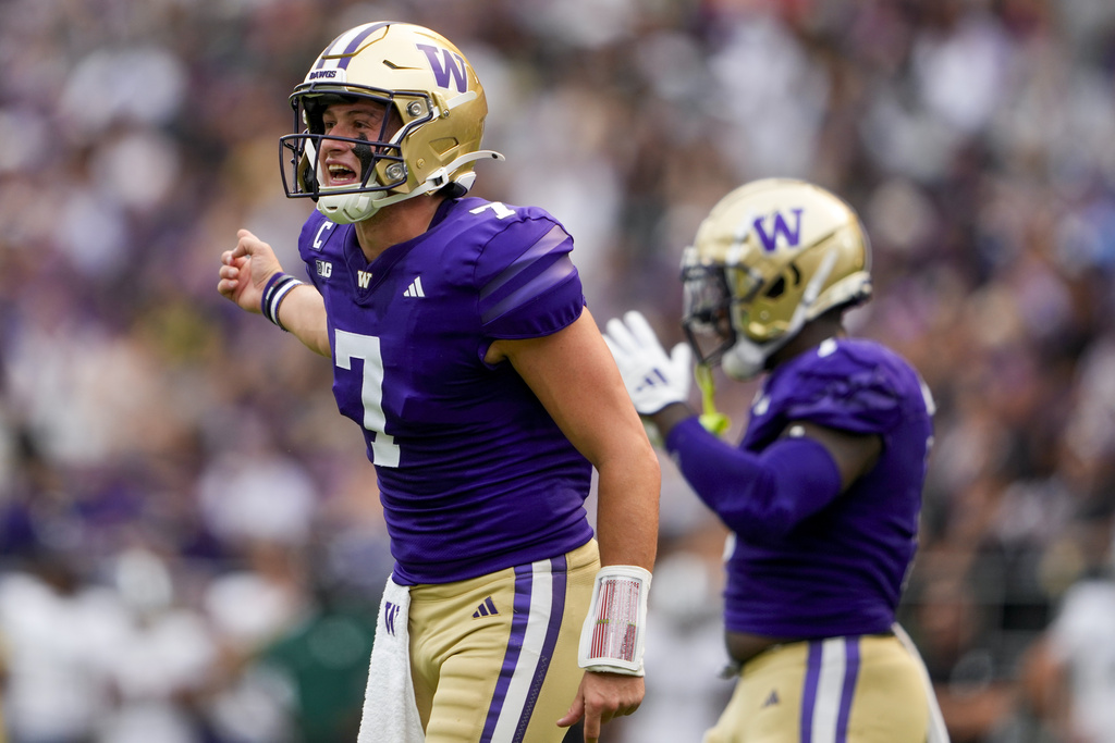 Washington quarterback Will Rogers (7) reacts during the first half of an NCAA college football game against Eastern Michigan, Saturday, Sept. 7, 2024, in Seattle.