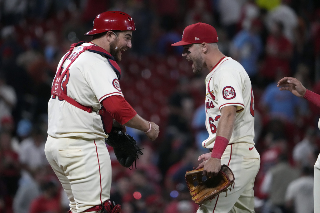 St. Louis Cardinals' Pedro Pages, left, and teammate Michael Siani celebrate a 2-0 victory over the Seattle Mariners in a baseball game Saturday, Sept. 7, 2024, in St. Louis.