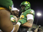 Oregon place kicker Atticus Sappington (36) is congratulated by teammates after his game-winning field goal after an NCAA college football game against Boise State, Saturday, Sept. 7, 2024, at Autzen Stadium in Eugene, Ore.