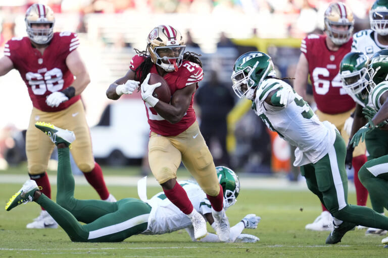 San Francisco 49ers running back Jordan Mason (24) runs against the New York Jets during the first half of an NFL football game in Santa Clara, Calif., Monday, Sept. 9, 2024. (AP Photo/Godofredo A.