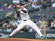 Seattle Mariners starting pitcher Bryan Woo throws during the first inning of a baseball game against the San Diego Padres, Wednesday, Sept. 11, 2024, in Seattle.