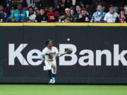 Seattle Mariners center fielder Julio Rodríguez catches the double hit by Texas Rangers' Wyatt Langford after it bounces in front of him during the eighth inning of a baseball game Thursday, Sept. 12, 2024, in Seattle.