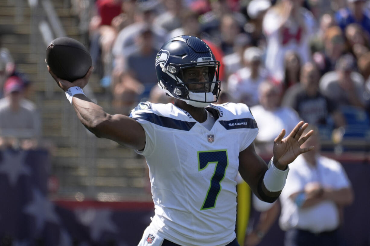 Seattle Seahawks quarterback Geno Smith winds up to pass in the first half of an NFL football game against the New England Patriots, Sunday, Sept. 15, 2024, in Foxborough, Mass.