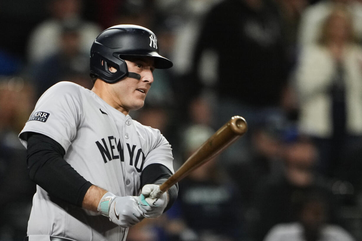 New York Yankees' Anthony Rizzo follows through on an RBI double against the Seattle Mariners during the 10th inning of a baseball game Wednesday, Sept. 18, 2024, in Seattle.