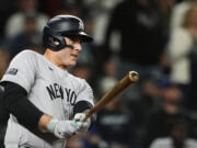 New York Yankees' Anthony Rizzo follows through on an RBI double against the Seattle Mariners during the 10th inning of a baseball game Wednesday, Sept. 18, 2024, in Seattle.