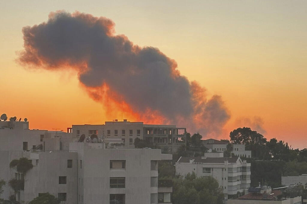 Smoke rises from Israeli airstrikes in Beirut, seen from Baabda, Friday, Sept. 27, 2024.