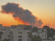 Smoke rises from Israeli airstrikes in Beirut, seen from Baabda, Friday, Sept. 27, 2024.