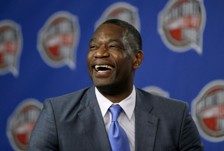 FILE - Former NBA basketball player Dikembe Mutombo laughs during a news conference announcing him as one of the 12 finalists of this year's hall of fame class during an event ahead of the NBA All Star basketball game, on Feb. 14, 2015, in New York.